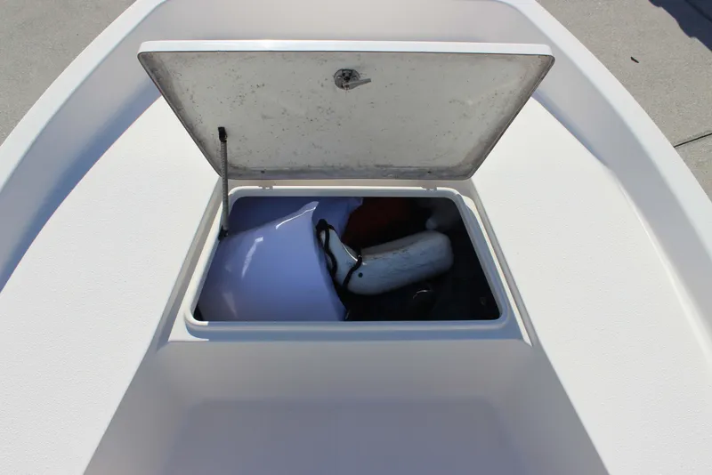 Slide: The Image of Open storage compartment on 2017 Bulls Bay 2000 boat, containing boating equipment. - 9