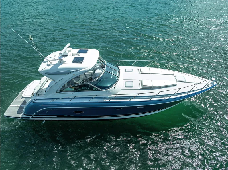 Slide: The Image of 2022 Formula 40 PC yacht cruising on clear blue water. - 10