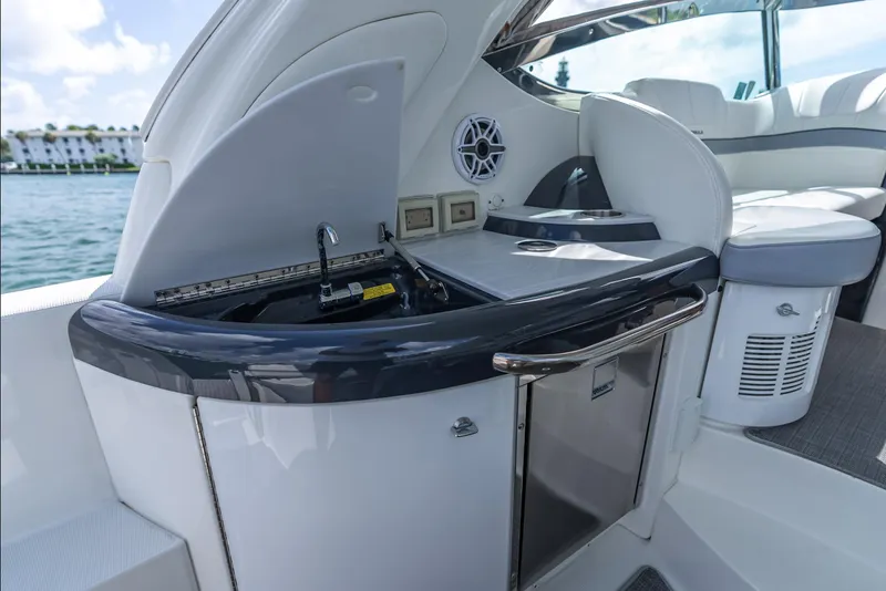 Slide: The Image of 2022 Formula 40 PC yacht interior with kitchenette and seating area. - 19