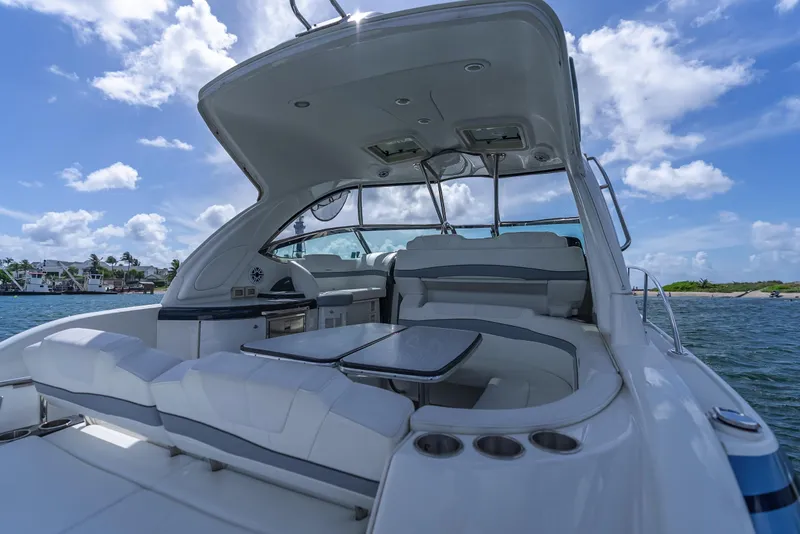 Slide: The Image of Luxury 2022 Formula 40 PC yacht interior with seating, table, and ocean view. - 22