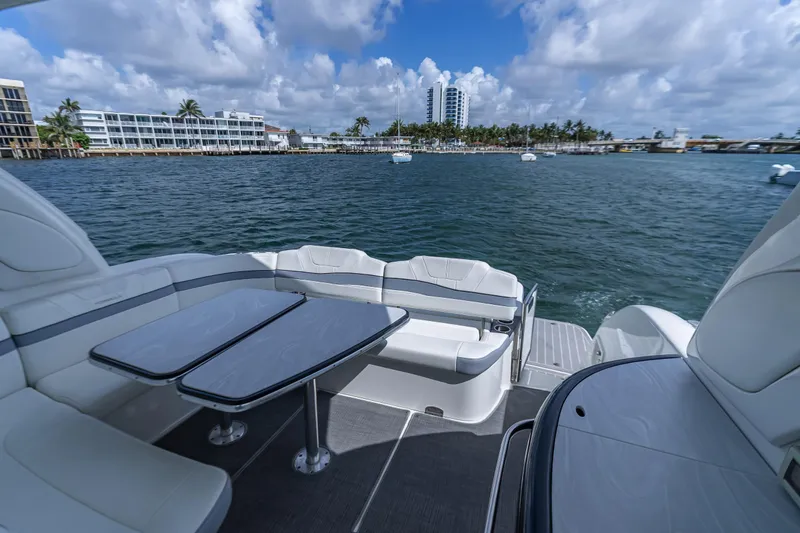 Slide: The Image of Luxury seating area on 2022 Formula 40 PC yacht overlooking scenic waterfront. - 26