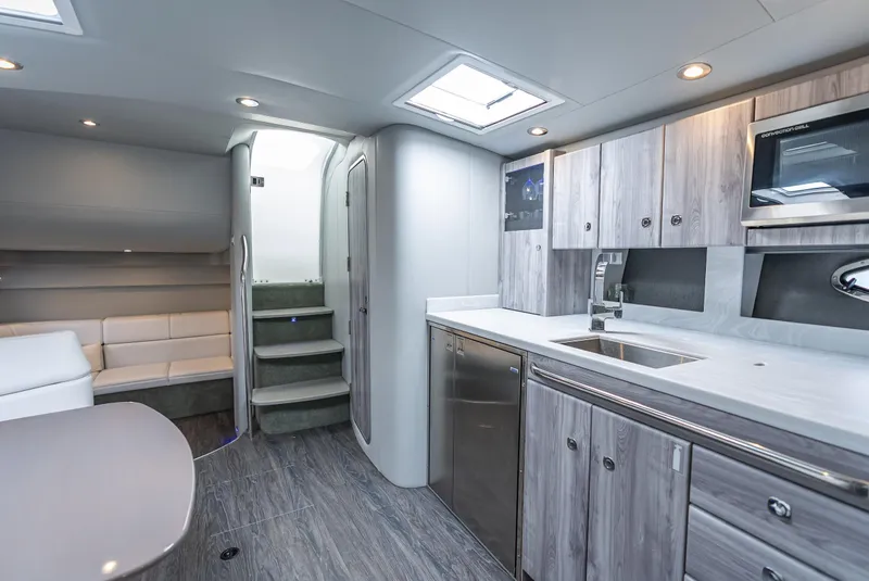 Slide: The Image of Luxurious interior of 2022 Formula 40 PC yacht with modern kitchen and seating area. - 32