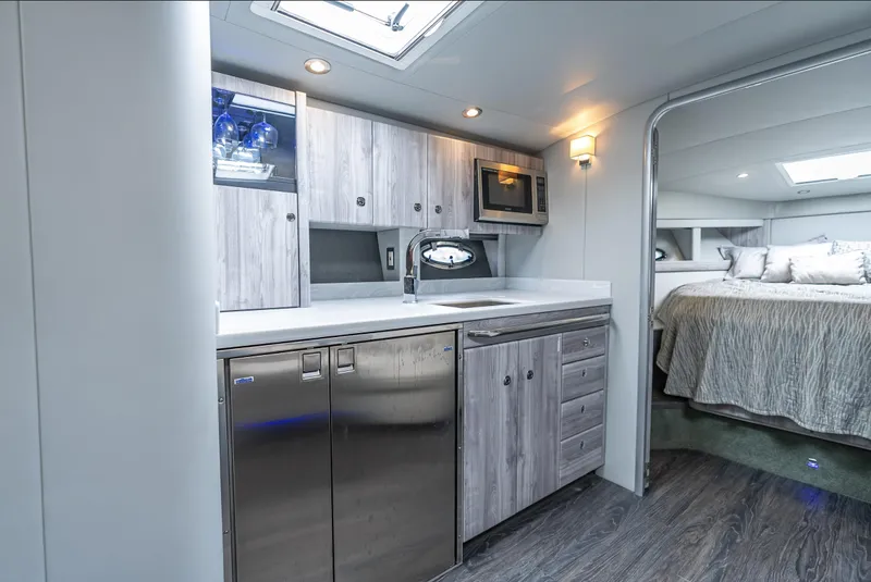 Slide: The Image of Modern yacht interior with kitchenette and bedroom, Formula 40 PC, 2022 model. - 36