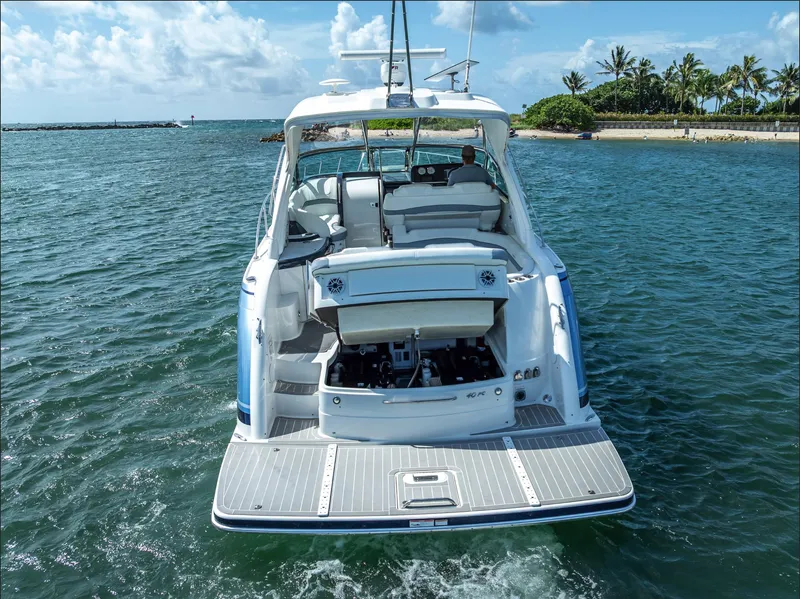 Slide: The Image of 2022 Formula 40 PC yacht cruising near tropical shoreline under blue sky. - 41