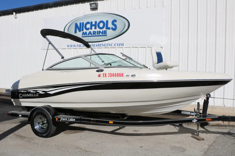 Slide: The Image of 2004 Caravelle 187 Fish & Ski boat on trailer at Nichols Marine dealership. - 1