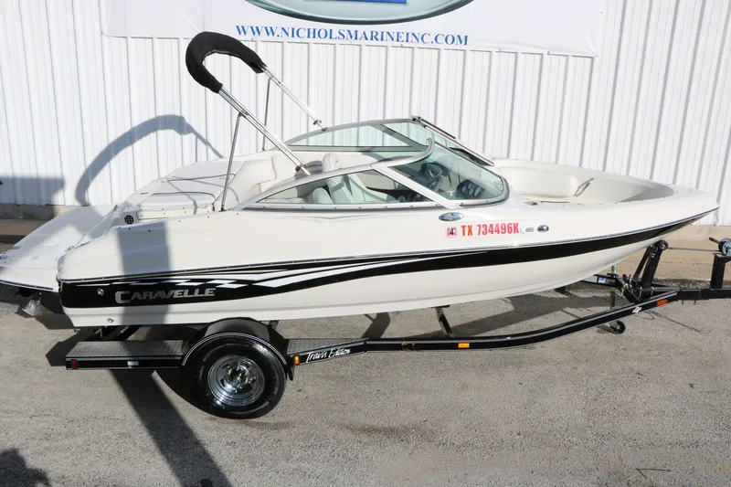 Slide: The Image of 2004 Caravelle 187 Fish & Ski boat on trailer, white with black accents. - 11