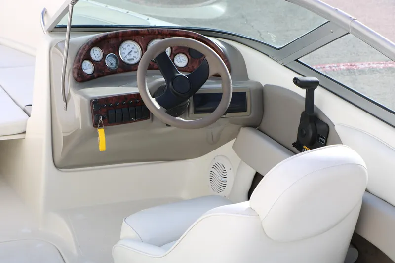 Slide: The Image of 2004 Caravelle 187 Fish & Ski boat interior with steering wheel and dashboard controls. - 15