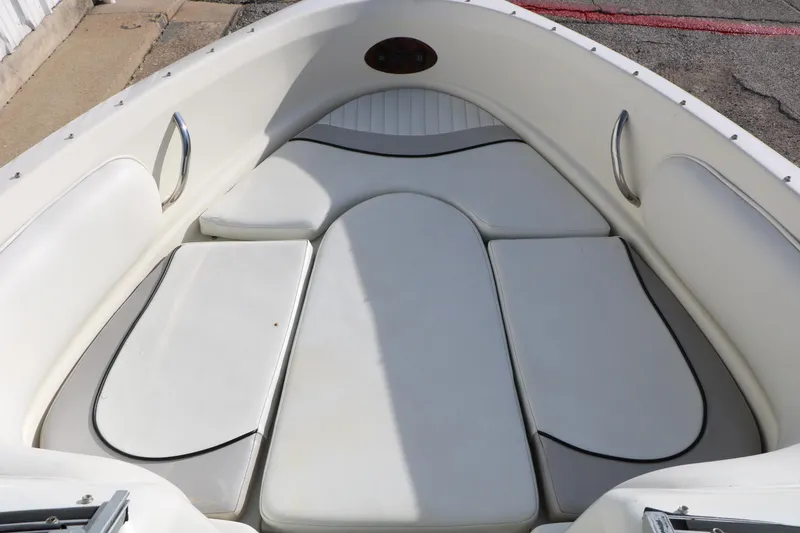 Slide: The Image of 2004 Caravelle 187 Fish & Ski boat interior with cushioned seating area. - 17