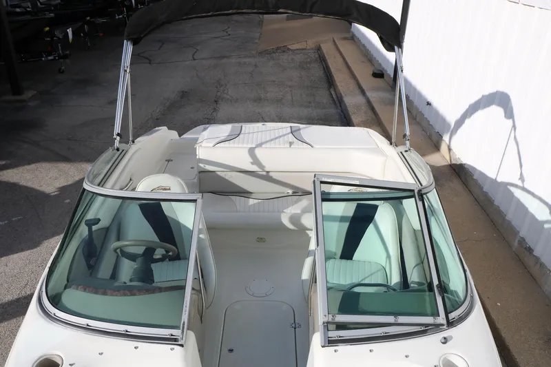 Slide: The Image of 2004 Caravelle 187 Fish & Ski boat interior with open windshield and seating. - 19