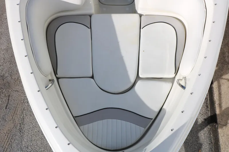 Slide: The Image of 2004 Caravelle 187 Fish & Ski boat interior with cushioned seating. - 20