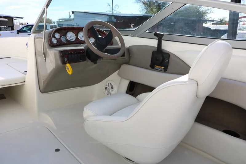 Slide: The Image of 2004 Caravelle 187 Fish & Ski boat interior with steering wheel and gauges. - 22