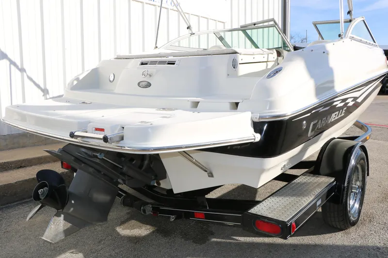 Slide: The Image of 2004 Caravelle 187 Fish & Ski boat on trailer, rear view, white and black design. - 4