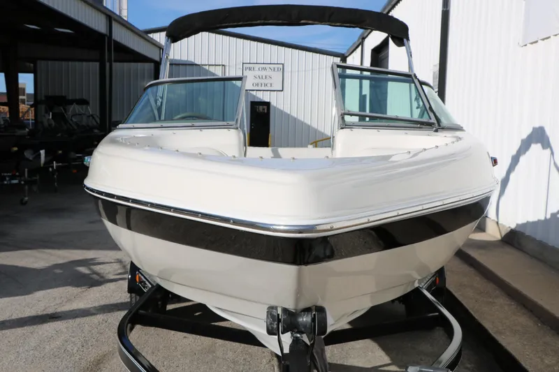 Slide: The Image of 2004 Caravelle 187 Fish & Ski boat in a showroom, front view. - 7