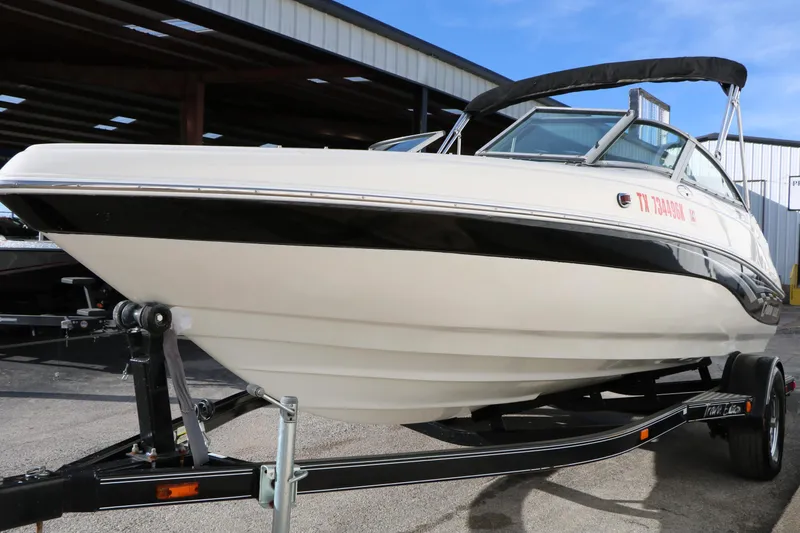 Slide: The Image of 2004 Caravelle 187 Fish & Ski boat on trailer, parked outdoors. - 8