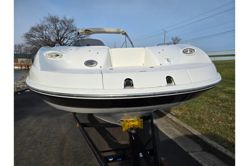 Slide: The Image of 2002 Chaparral Sunesta 242 boat on trailer, front view, outdoors. - 6