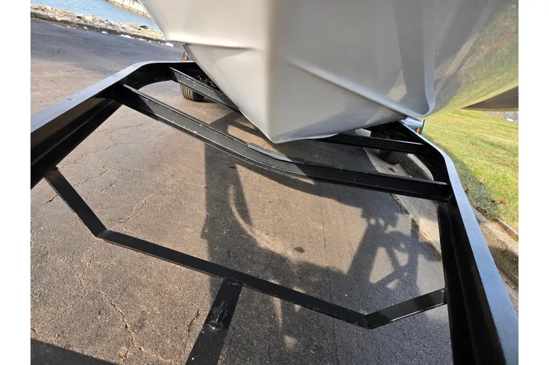 Slide: The Image of 2002 Chaparral Sunesta 242 boat on trailer, parked near waterfront. - 7