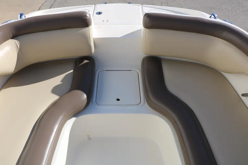 Slide: The Image of 2017 Bayliner 195 Deck Boat interior seating with beige and brown upholstery. - 16