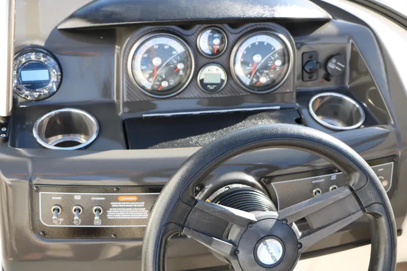 Slide: The Image of Dashboard of 2017 Bayliner 195 Deck Boat with steering wheel and gauges. - 22