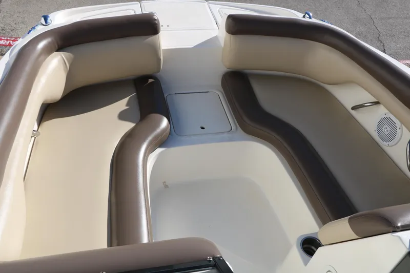 Slide: The Image of 2017 Bayliner 195 Deck Boat interior with beige and brown seating. - 26