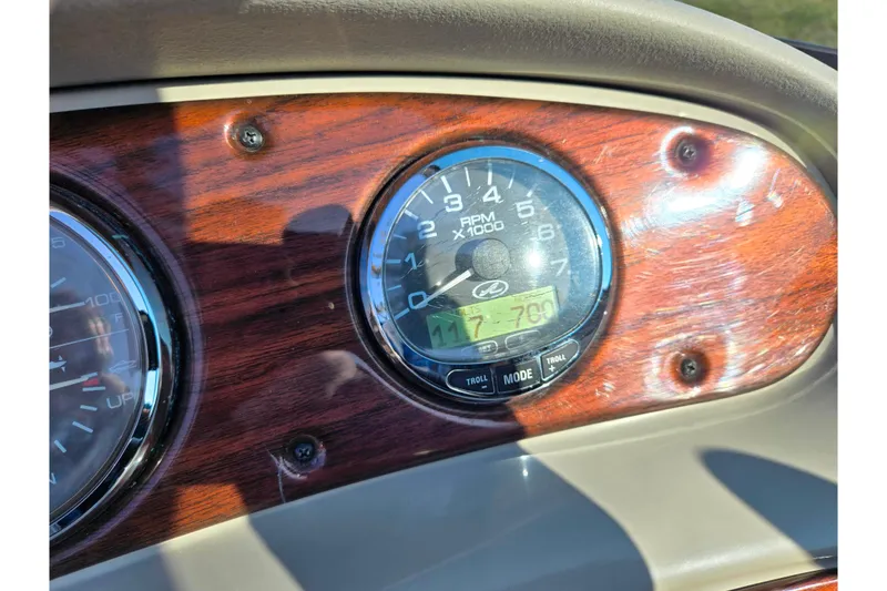 Slide: The Image of Dashboard of a 2005 Sea Ray 240 Sundeck boat with RPM gauge. - 26