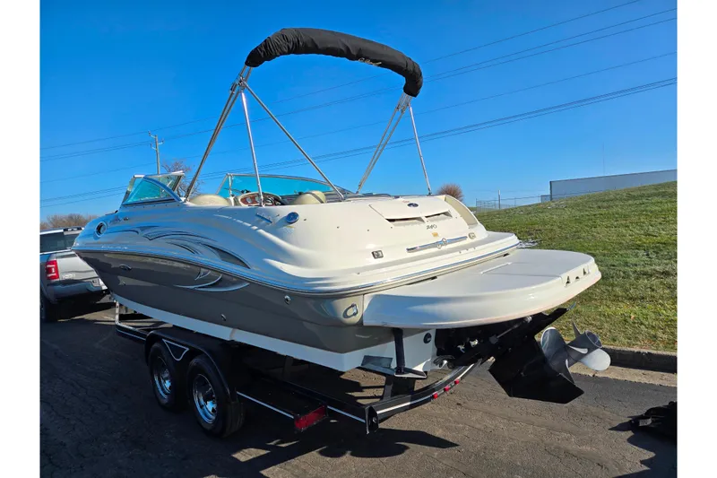 Slide: The Image of 2005 Sea Ray 240 Sundeck boat on trailer, sunny day, rear view. - 3