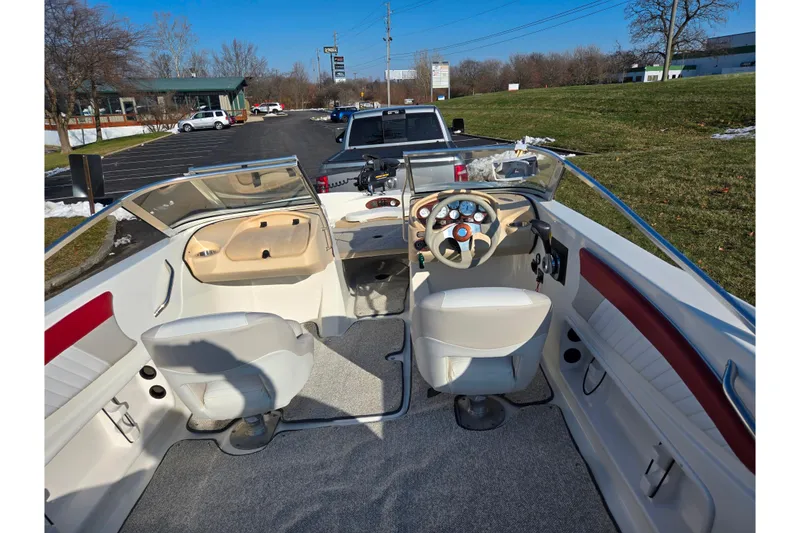 Slide: The Image of 2007 Glastron GT 205 Ski & Fish boat interior with steering wheel and seating. - 11