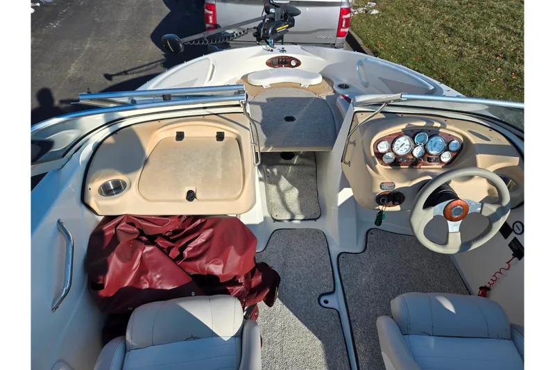 Slide: The Image of 2007 Glastron GT 205 Ski & Fish boat interior with dashboard and seating. - 12