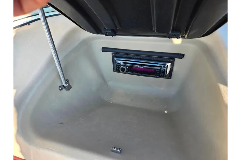 Slide: The Image of 2007 Glastron GT 205 Ski & Fish boat storage compartment with stereo system. - 17