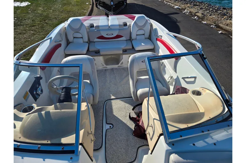 Slide: The Image of 2007 Glastron GT 205 Ski & Fish boat interior with seating and steering wheel. - 20