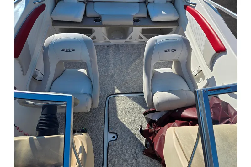 Slide: The Image of 2007 Glastron GT 205 Ski & Fish boat interior with white seats and red accents. - 21
