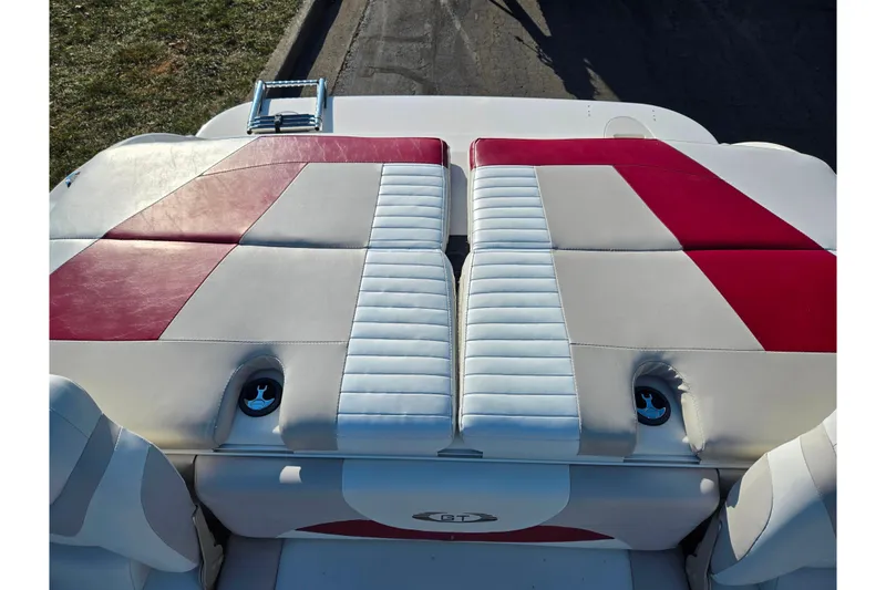 Slide: The Image of 2007 Glastron GT 205 Ski & Fish boat with red and white cushioned seating. - 23