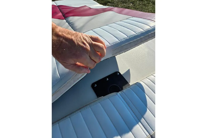 Slide: The Image of Hand lifting seat cushion on 2007 Glastron GT 205 Ski & Fish boat. - 25