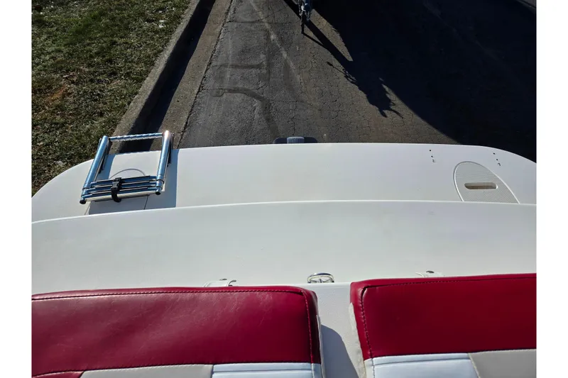 Slide: The Image of 2007 Glastron GT 205 Ski & Fish boat with red and white seating, rear view. - 26