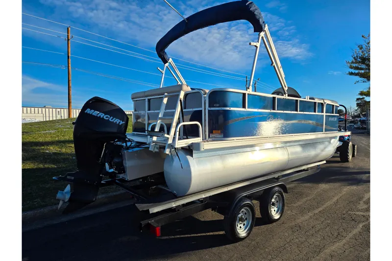 Slide: The Image of 2012 Berkshire 190CL LSR pontoon boat with Mercury outboard engine on trailer. - 3