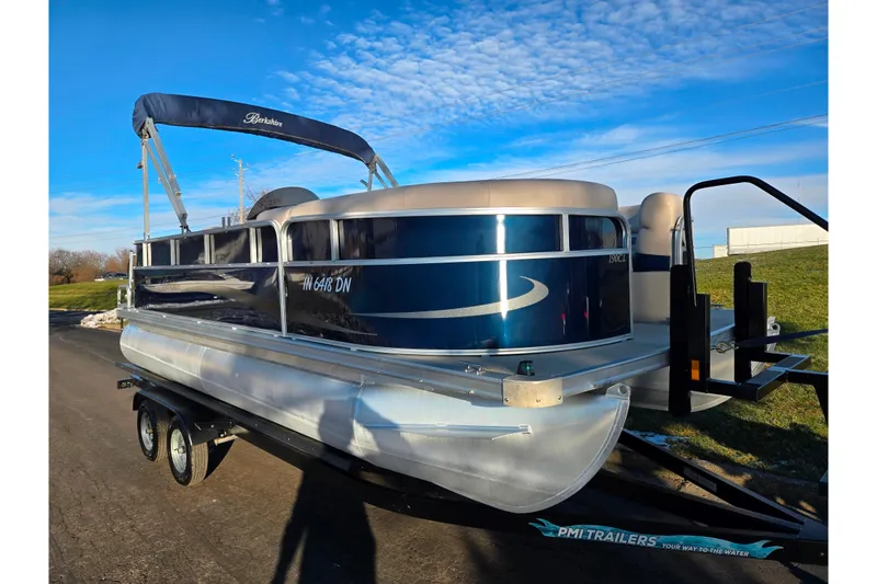 Slide: The Image of 2012 Berkshire 190CL LSR pontoon boat on trailer under blue sky. - 5