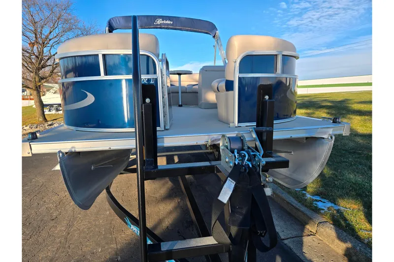 Slide: The Image of 2012 Berkshire 190CL LSR pontoon boat on trailer, blue and beige design. - 6