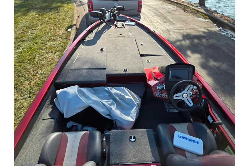 Slide: The Image of 2019 Vexus AVX1980 boat interior with steering wheel, Lowrance device, and seating. - 12