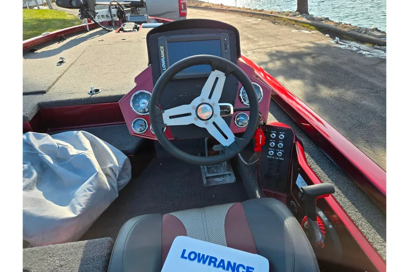 Slide: The Image of 2019 Vexus AVX1980 boat cockpit with steering wheel and Lowrance electronics. - 13