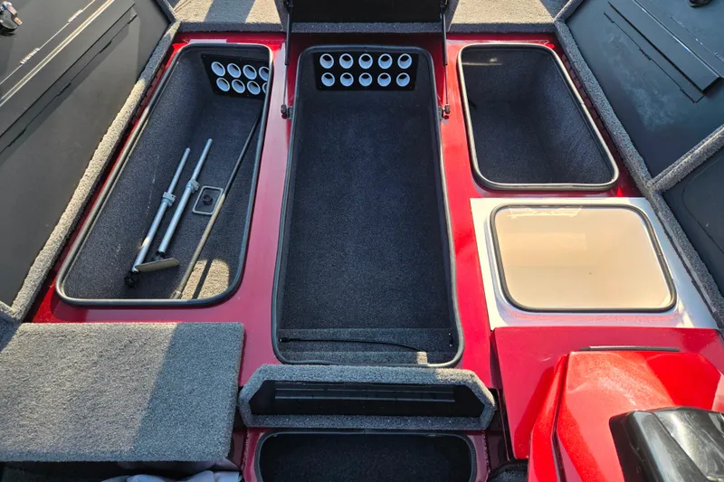 Slide: The Image of 2019 Vexus AVX1980 boat interior with storage compartments and rod holders. - 16