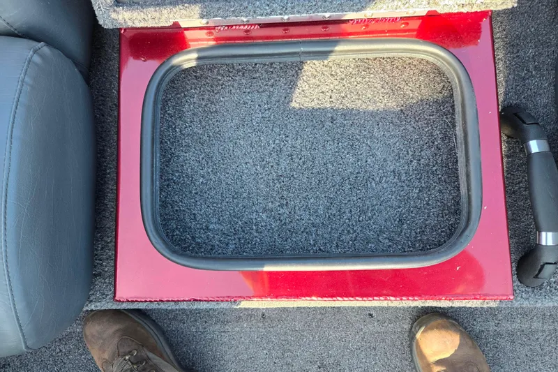 Slide: The Image of 2019 Vexus AVX1980 boat storage compartment with red trim and gray carpet. - 21
