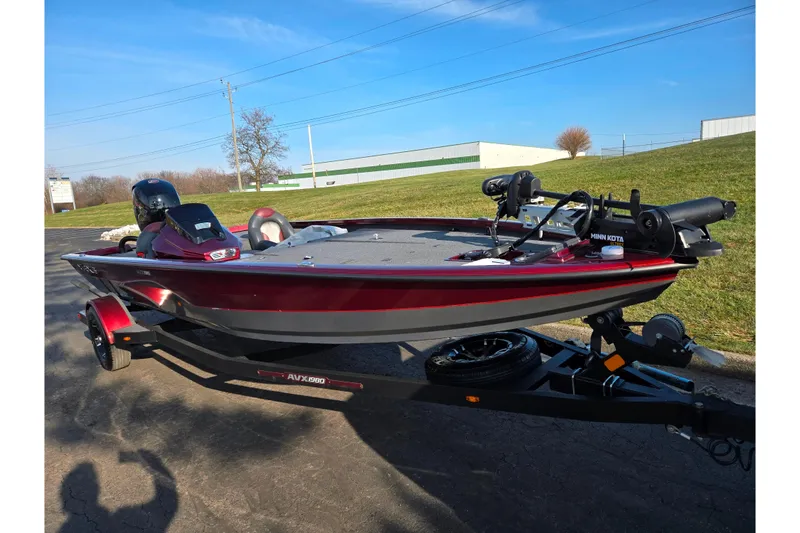 Slide: The Image of 2019 Vexus AVX1980 boat on trailer, red and gray, parked outdoors. - 5