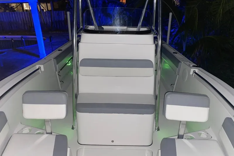 Slide: The Image of 2019 Release 208RX boat on trailer under clear blue sky. - 12