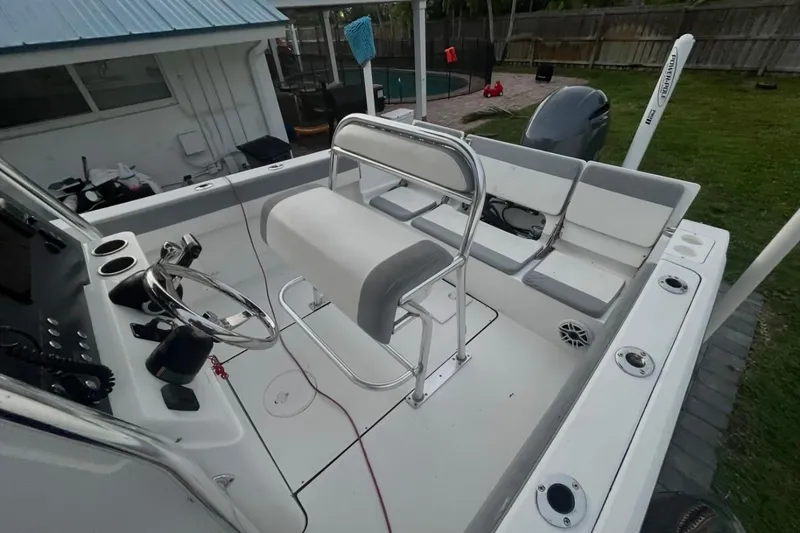 Slide: The Image of 2019 Release 208RX boat interior with seating and storage compartments. - 13