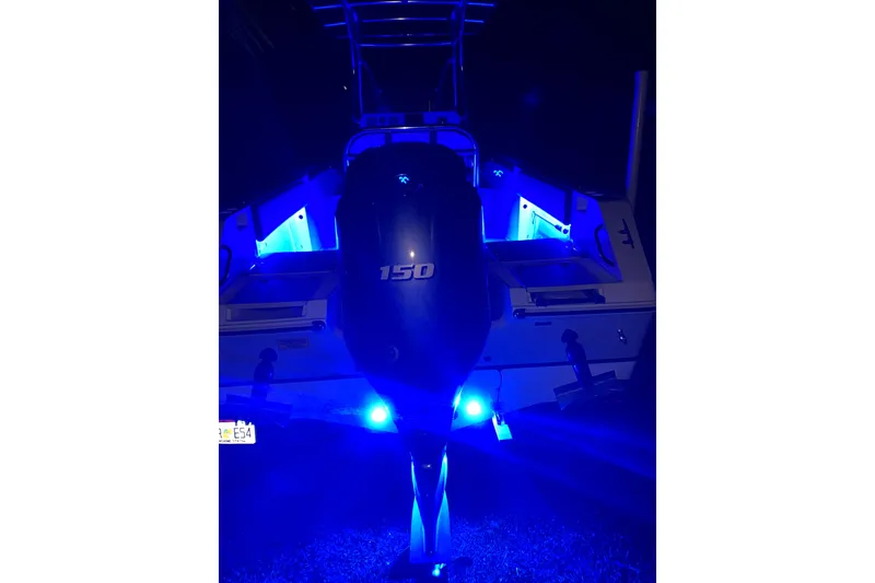 Slide: The Image of 2019 Release 208RX boat for sale at dealership, featuring center console and T-top. - 15