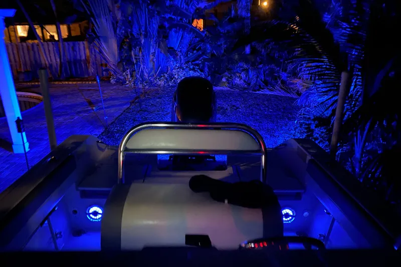 Slide: The Image of 2019 Release 208RX boat interior with rod holders and steering console. - 17