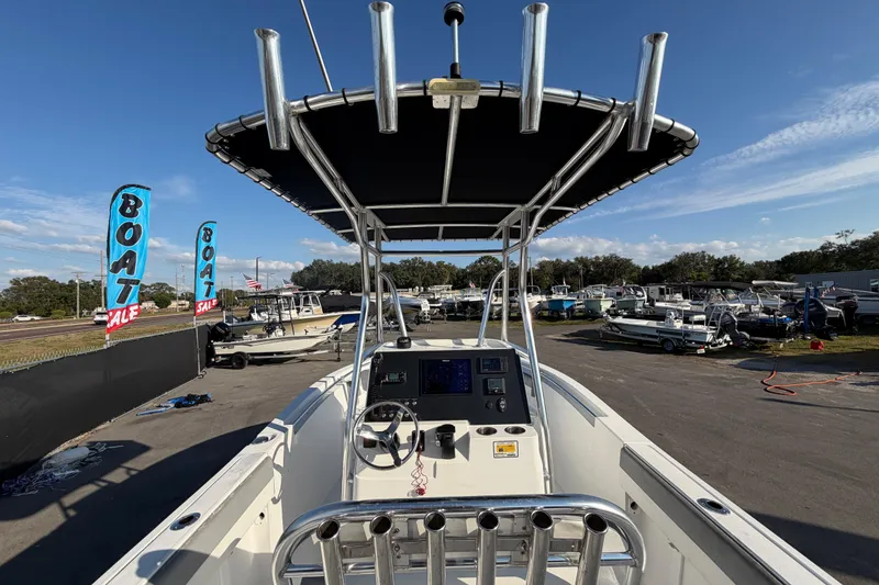 Slide: The Image of 2019 Release 208RX boat for sale at dealership, featuring console and T-top. - 19