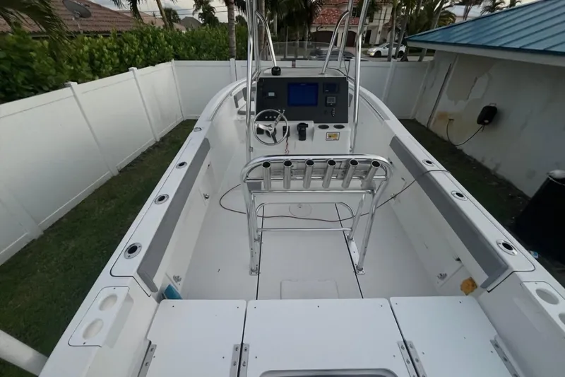 Slide: The Image of 2019 Release 208RX boat with Yamaha engine on trailer under clear sky. - 2