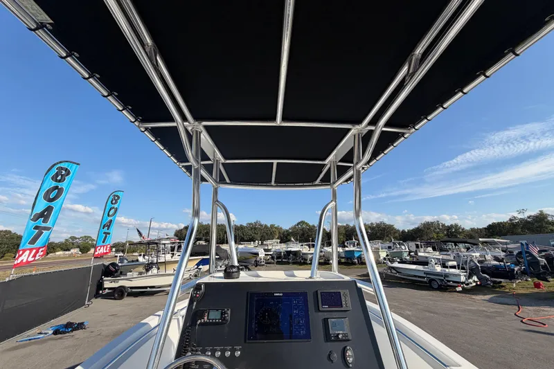 Slide: The Image of 2019 Release 208RX boat at sale event, featuring control panel and canopy. - 22