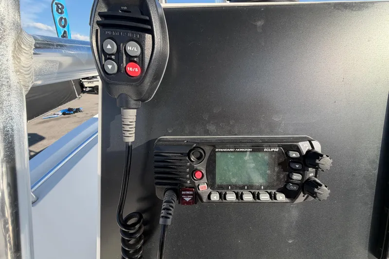 Slide: The Image of Marine radio equipment on a 2019 Release 208RX boat, featuring Standard Horizon Eclipse. - 26