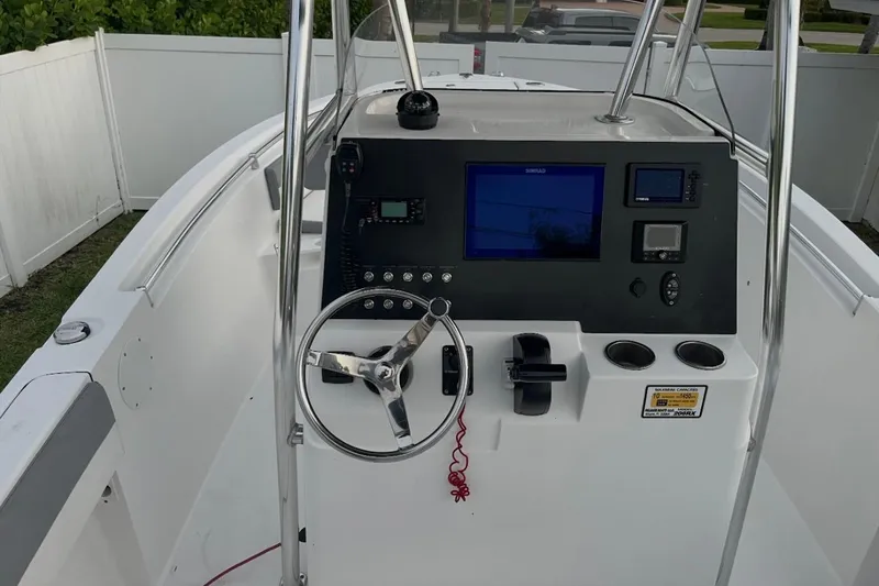 Slide: The Image of 2019 Release 208RX boat with Yamaha outboard motor, displayed outdoors. - 3